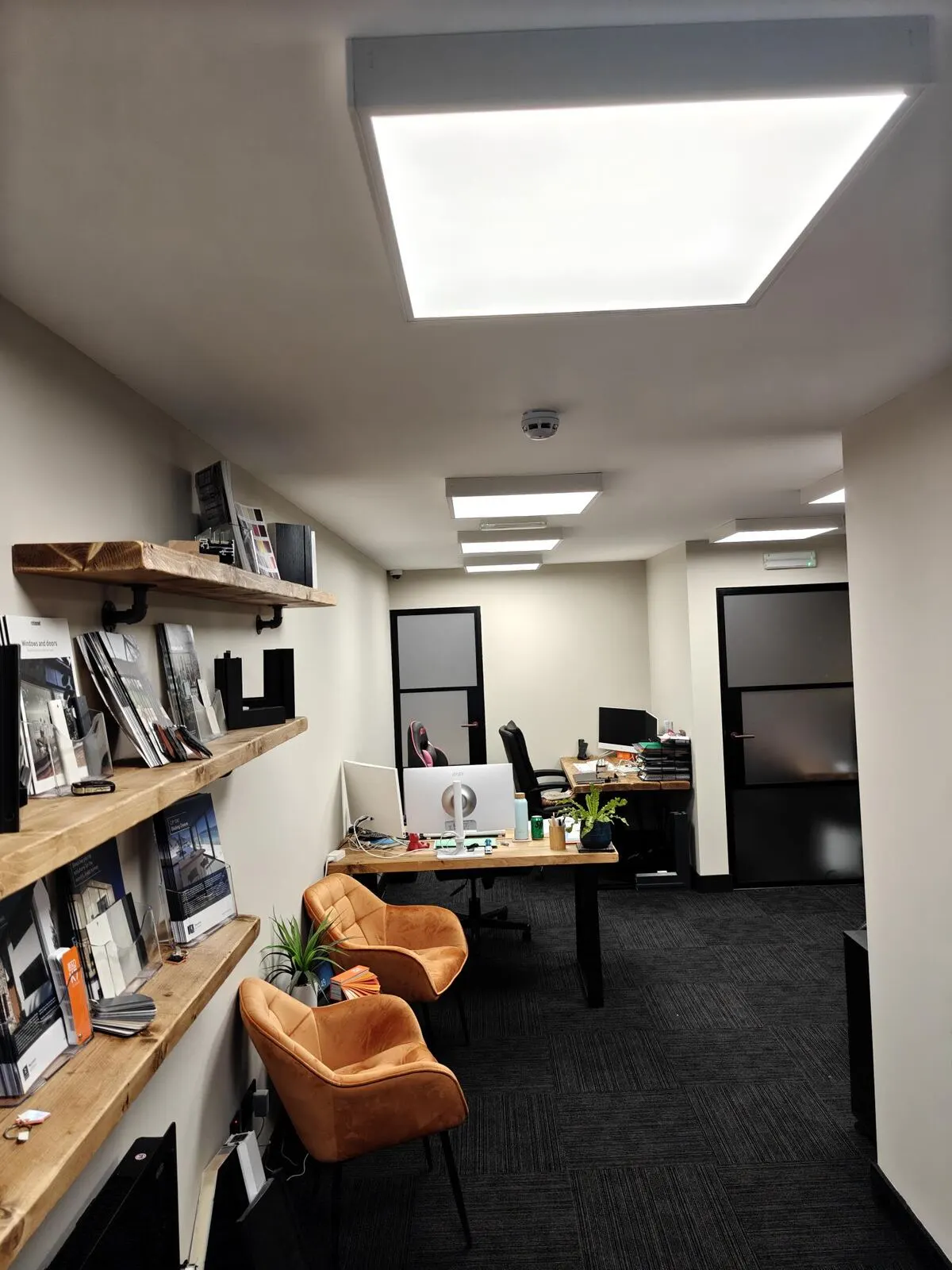 Office interior with modern lighting